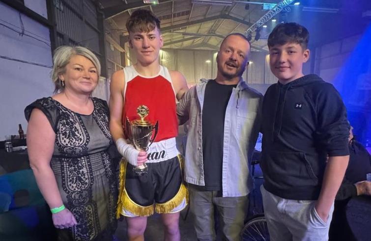 Sean with proud parents and brother